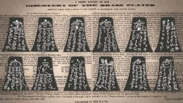 Kinderhook Plates in front of a newspaper article